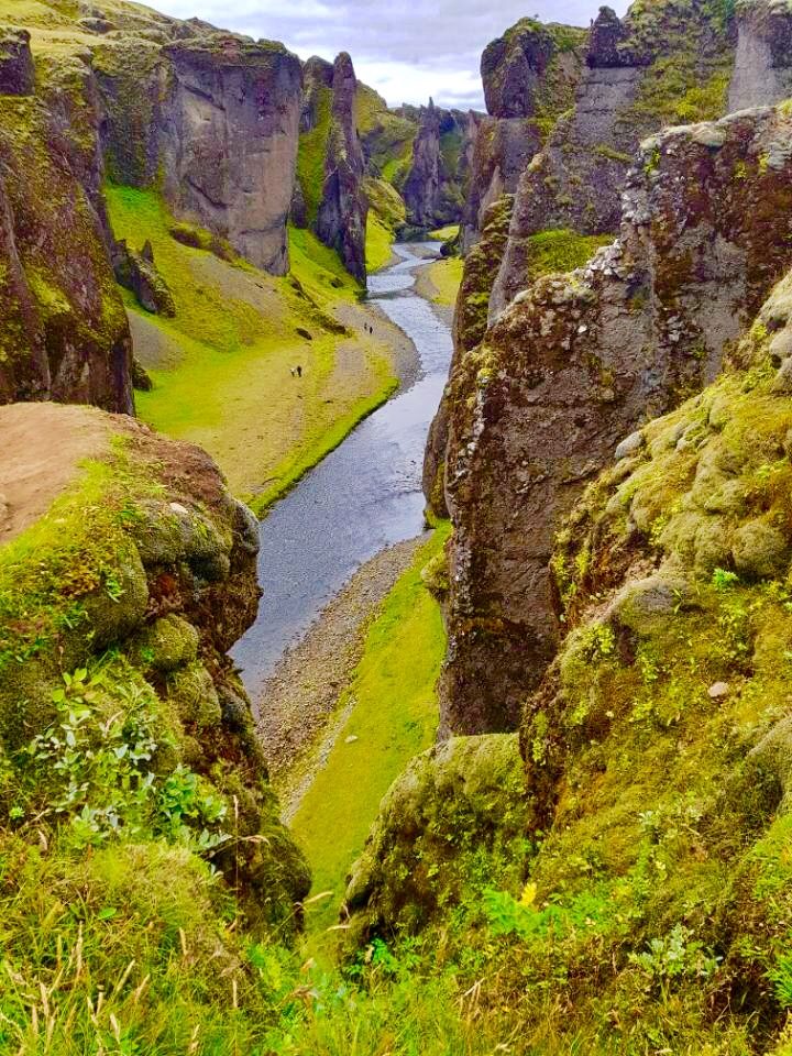 Fjaðrárgljúfur canyon, a river winding between mossy walls